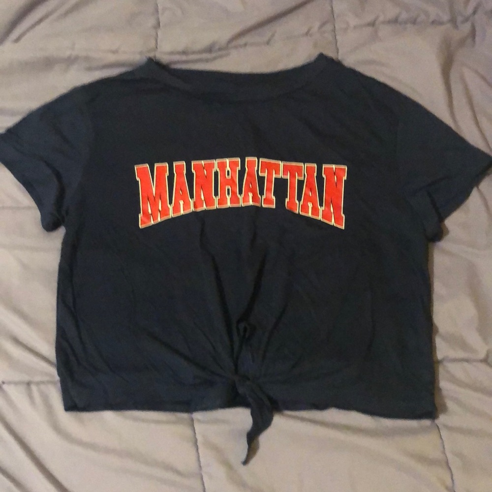 Navy blue shirt with the word Manhattan